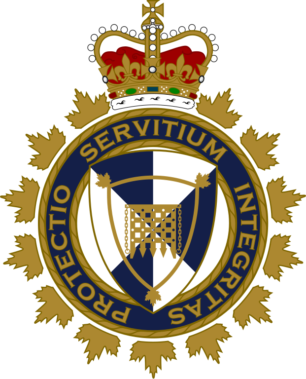 A circle with the motto "Protectio Servitium Integritas." The circle is surrounded by maple leaves and a crown on top. Inside the circle is a shield with a design featuring a medieval gate.